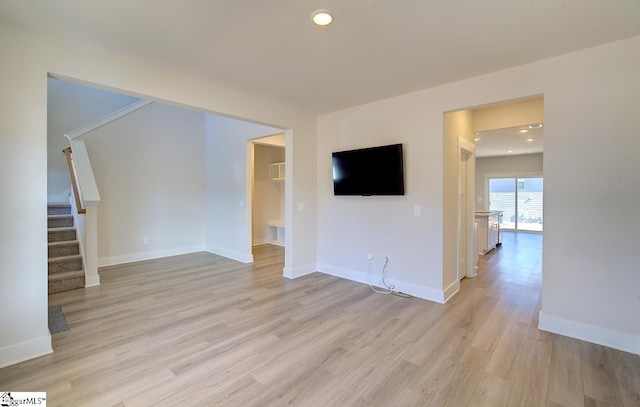 unfurnished living room featuring light wood-type flooring