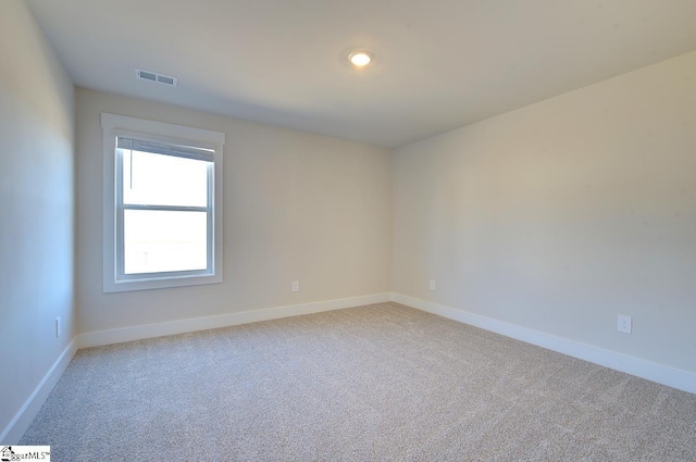 spare room with carpet floors