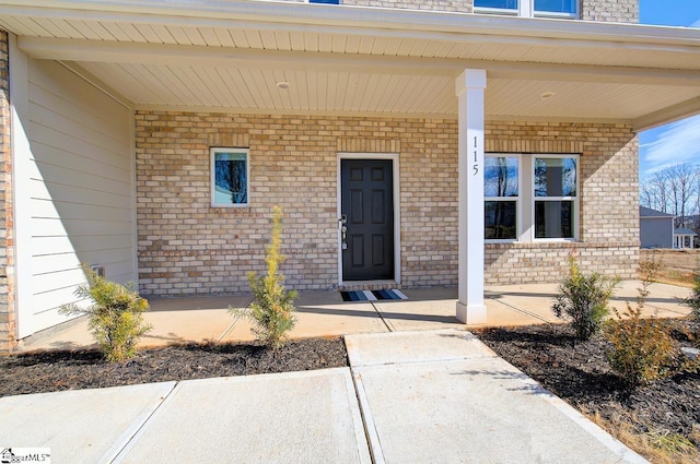 doorway to property with a porch