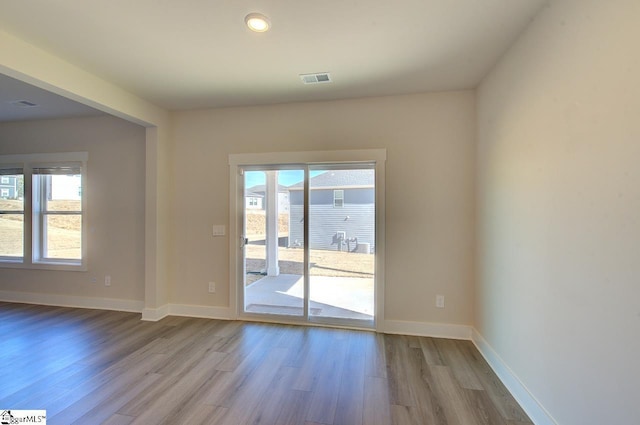 unfurnished room featuring light hardwood / wood-style flooring