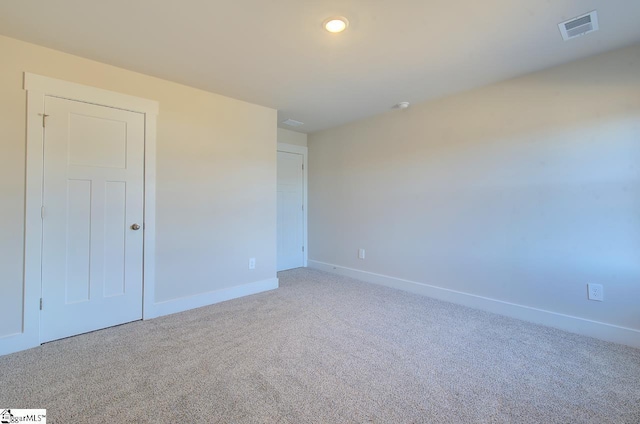 empty room featuring carpet floors