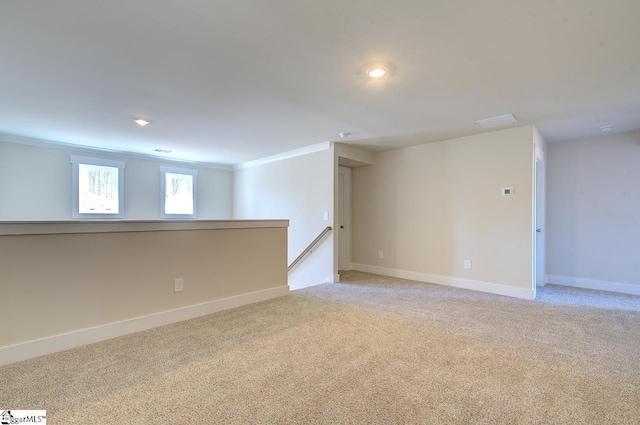 carpeted spare room with ornamental molding