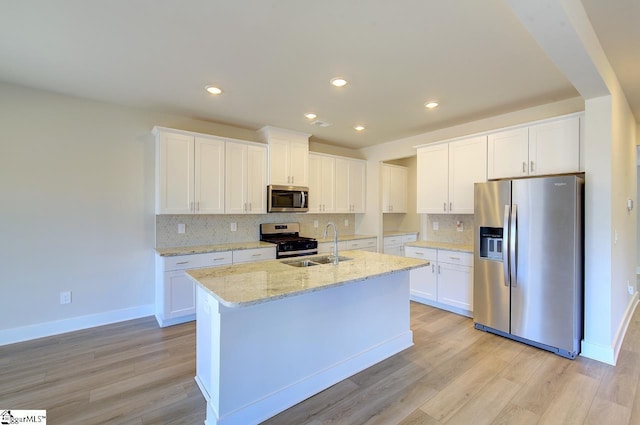 kitchen with white cabinetry, appliances with stainless steel finishes, and sink