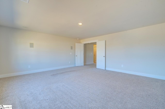 spare room with light carpet