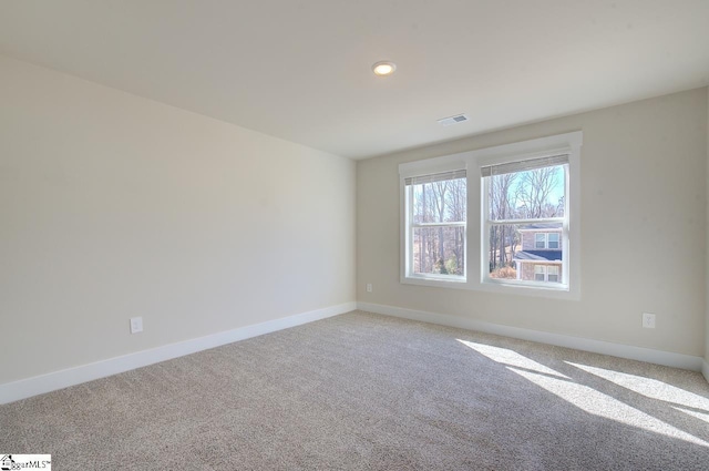 unfurnished room featuring carpet flooring