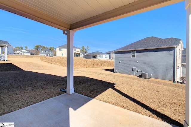 view of yard featuring central AC and a patio area