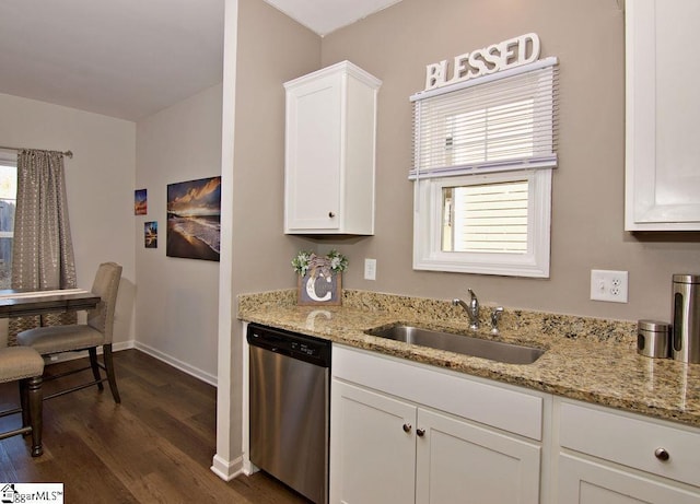 kitchen with sink, stainless steel dishwasher, white cabinets, and light stone countertops