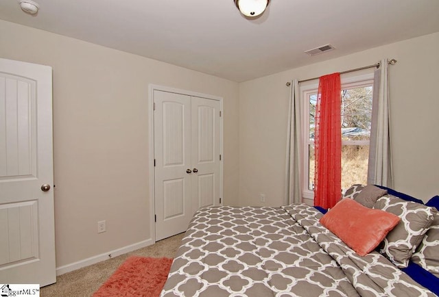 carpeted bedroom featuring a closet