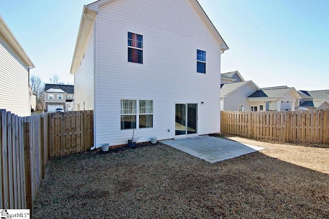 rear view of house featuring a patio