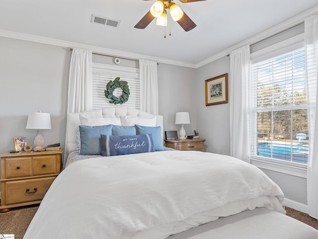 carpeted bedroom featuring crown molding, ceiling fan, and multiple windows