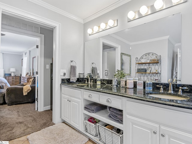 bathroom with crown molding, vanity, and tile patterned flooring