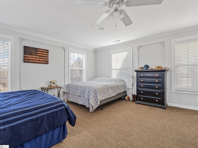 carpeted bedroom with crown molding and ceiling fan