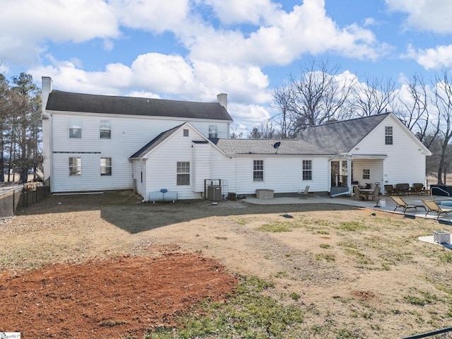 back of house featuring central AC and a patio area