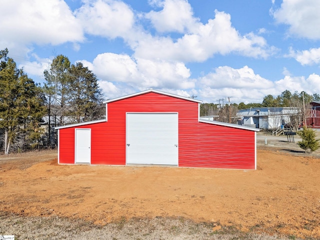 view of outbuilding featuring a garage