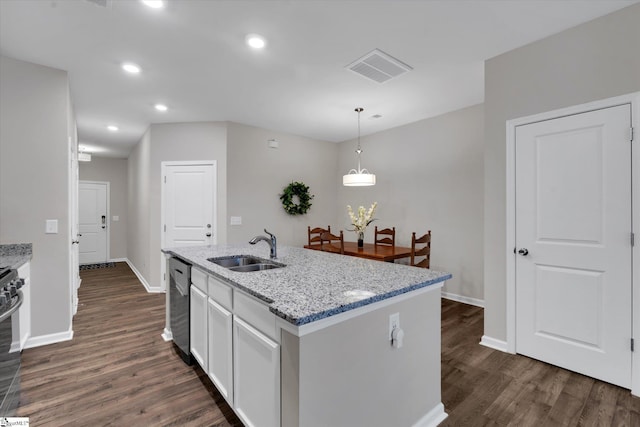 kitchen featuring pendant lighting, sink, light stone counters, an island with sink, and white cabinets