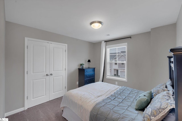 carpeted bedroom featuring a closet