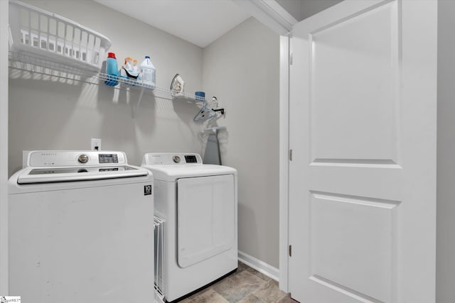 laundry area with separate washer and dryer