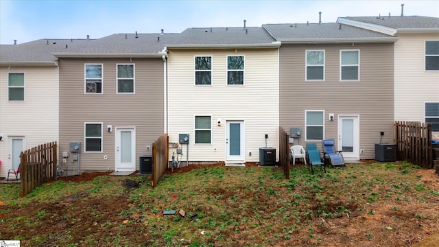 rear view of house with cooling unit