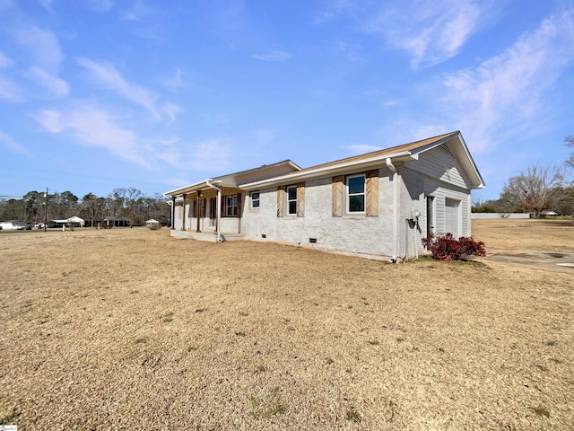 exterior space featuring a garage and a lawn