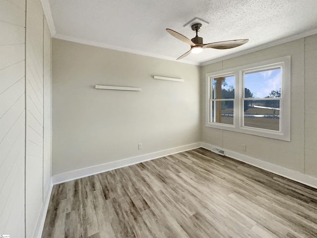 spare room with crown molding, ceiling fan, a textured ceiling, and light hardwood / wood-style flooring