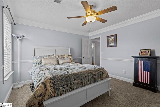 carpeted bedroom featuring ceiling fan, ornamental molding, and a textured ceiling