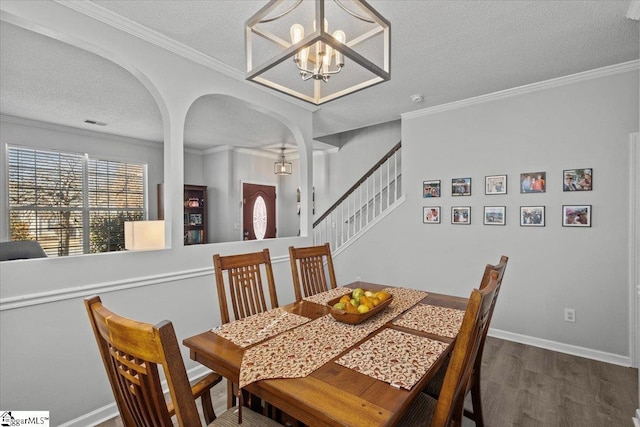 dining room featuring dark hardwood / wood-style flooring and crown molding