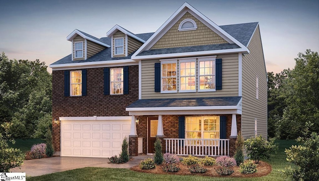 craftsman-style home featuring a garage and covered porch