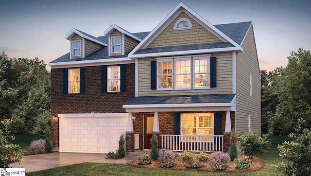 craftsman-style home with covered porch, driveway, a shingled roof, and an attached garage
