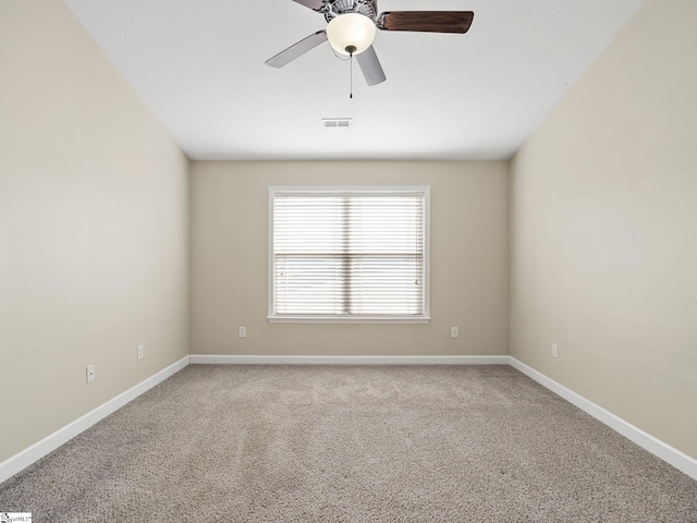 carpeted empty room featuring ceiling fan