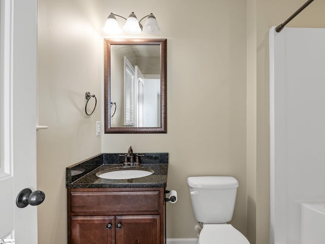 bathroom with vanity and toilet