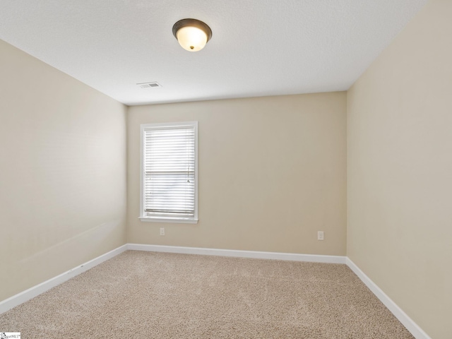 spare room featuring carpet floors