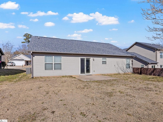 rear view of property featuring a lawn, a patio, and central air condition unit