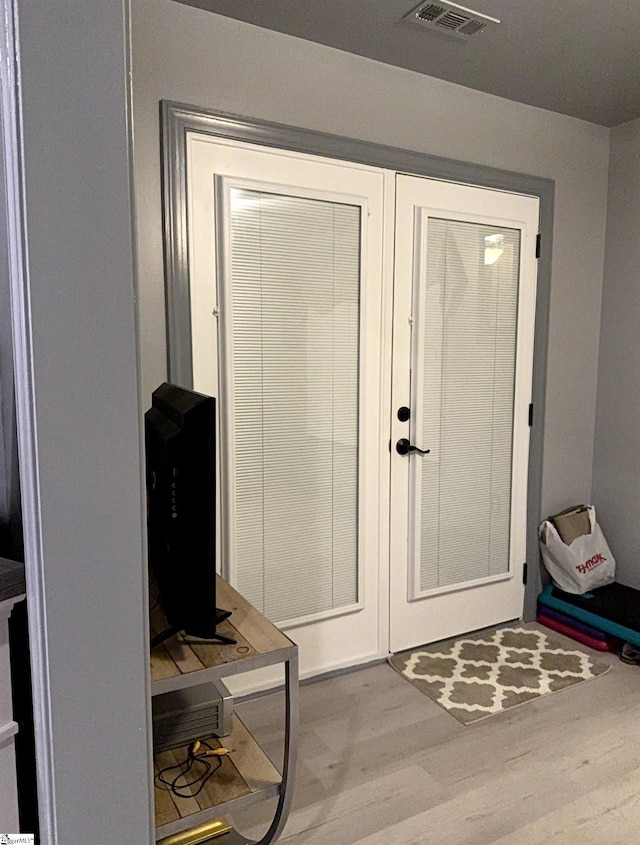 doorway featuring wood-type flooring