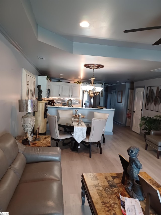 dining room featuring ceiling fan and light hardwood / wood-style flooring