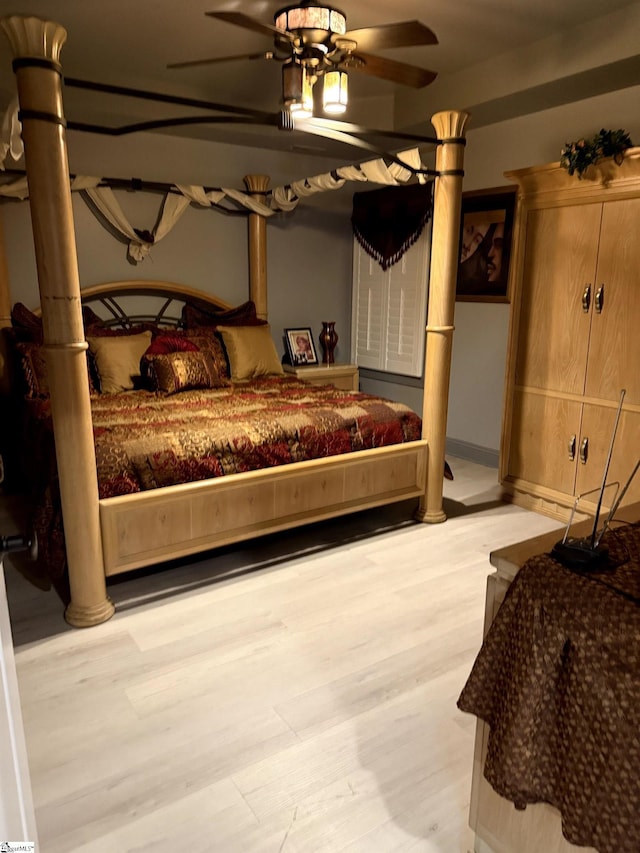 bedroom featuring ceiling fan and light hardwood / wood-style flooring