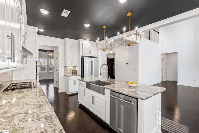 kitchen with white cabinetry, sink, and stainless steel appliances