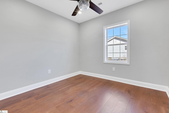 spare room featuring hardwood / wood-style flooring and ceiling fan