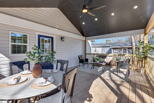 wooden terrace featuring ceiling fan and an outdoor living space