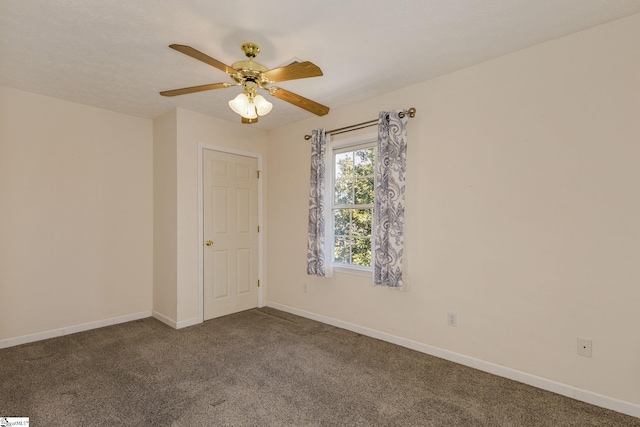 spare room with ceiling fan and carpet floors