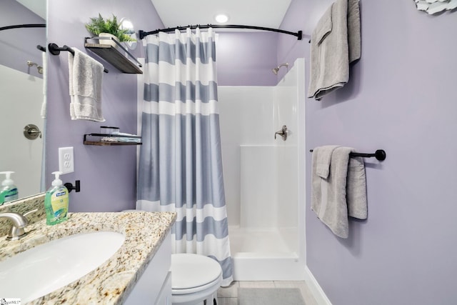 bathroom featuring a shower with curtain, vanity, toilet, and tile patterned flooring