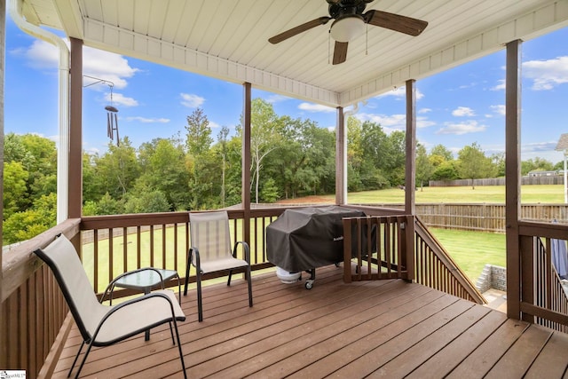 sunroom featuring ceiling fan