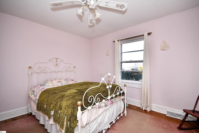 bedroom with hardwood / wood-style flooring and ceiling fan