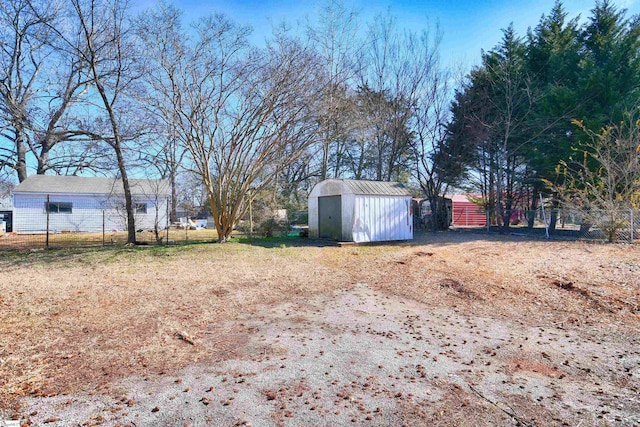 view of yard with a storage unit