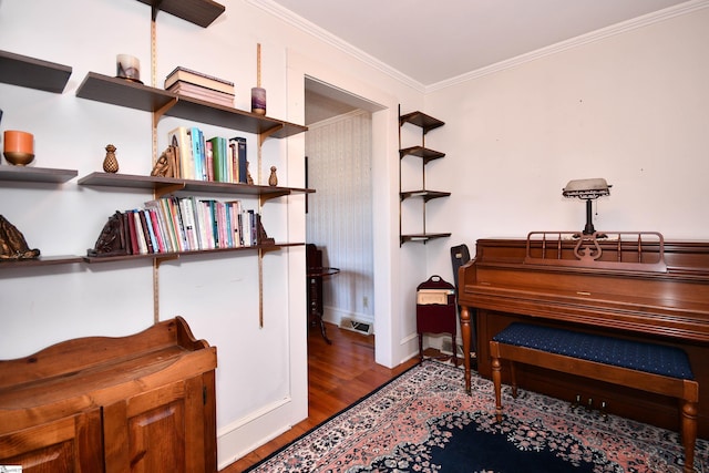 miscellaneous room featuring crown molding and hardwood / wood-style flooring