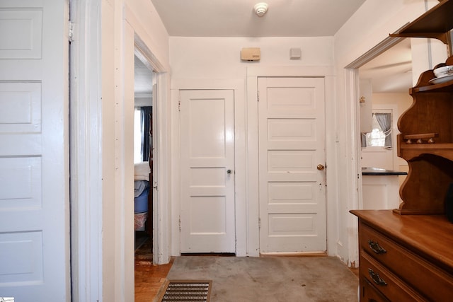 interior space featuring light colored carpet