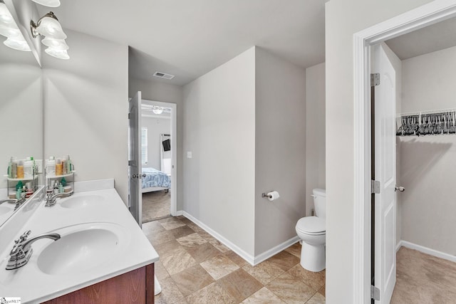 bathroom with vanity and toilet