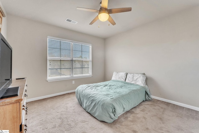 carpeted bedroom featuring ceiling fan