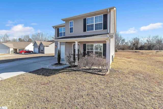 front of property with a porch, a garage, and a front yard