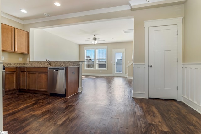 kitchen with kitchen peninsula, dishwasher, light stone counters, ceiling fan, and dark wood-type flooring