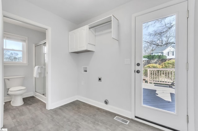 clothes washing area with electric dryer hookup and washer hookup